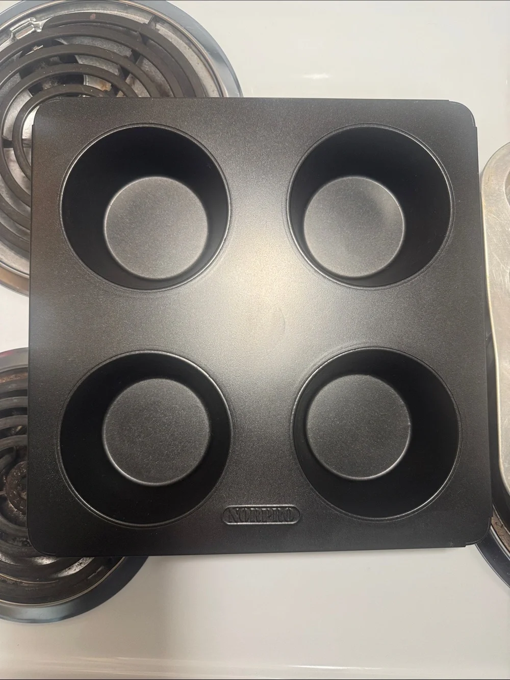 Two muffin pans, the large one is non-stick and NWOT. Small one is in GUC.